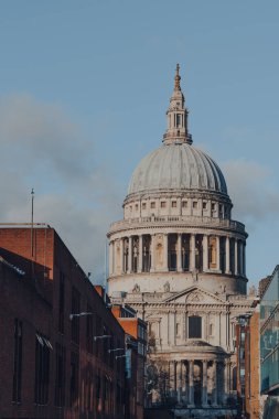 London, UK - November 19, 2020: View of St. Pauls Cathedral, the cathedral of the Bishop of London, from Millennium Bridge, selective focus.