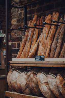 London, UK - August 16, 2019: Fresh bread on sale in Le Pain Quotidien, an international chain of bakery-restaurants. Selective focus.