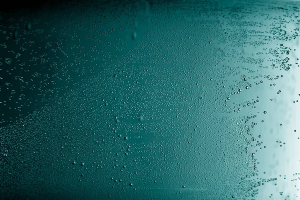 Abstract turquoise background with microscopic air bubbles. Bubbles background in aqua blue.