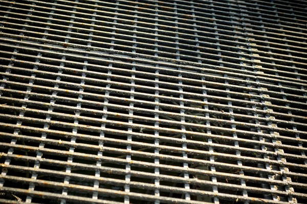 An iron mesh background.  Metal grid texture
