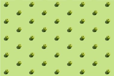 Yeşil arka planda yeşil aplikasyonlardan oluşan en az yinelenen desen