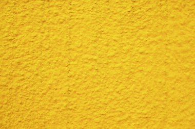 Sarı boyalı duvar arka planı. Renkli sarı doku.
