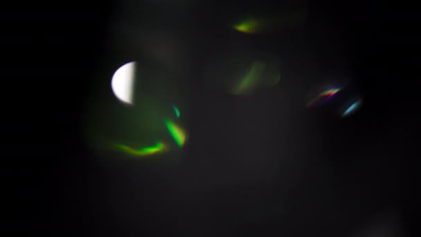 Festive rainbow lens flares. Beautiful light metamorphoses. Lights pulsing in dark space. Can be used for motion design web project. 4k UHD. — Stock Video