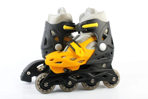 Yellow & Black Colored roller skates isolated on white — Stock Photo, Image