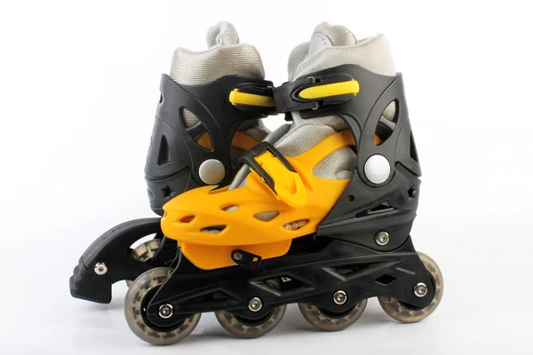 Yellow & Black Colored roller skates isolated on white — Stock Photo, Image