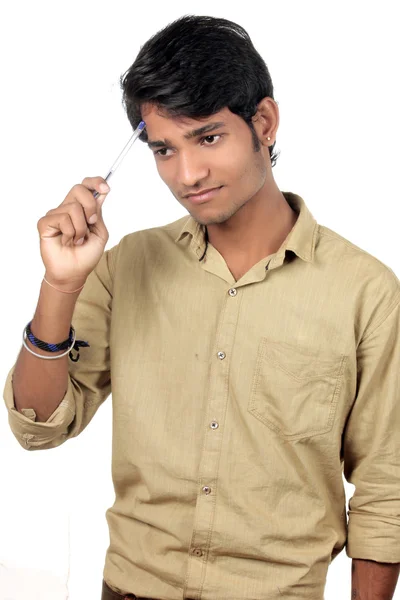 Beautiful Young Indian Boy thinking with pen — Stock Photo, Image