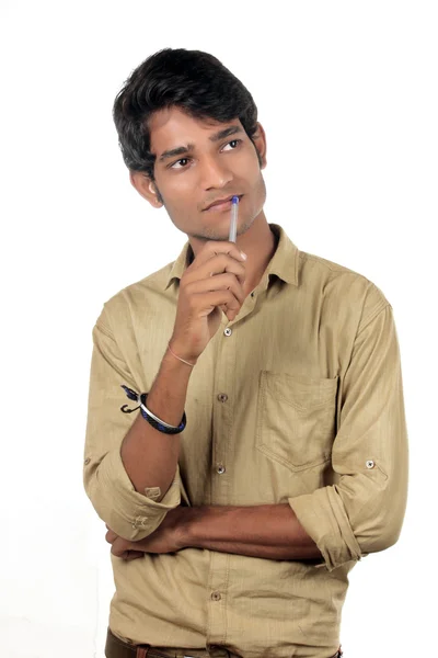 Beautiful Young Indian Boy thinking with pen — Stock Photo, Image