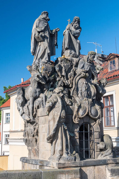 Prague, Czech Republic - July 10, 2020: Statues of John of Matha, Felix of Valois and Saint Ivan installed on the south side of the Charles Bridge.