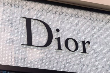 Prague, Czech Republic - July 10, 2020: Logo and sign of Dior. Dior is a French luxury goods company. clipart