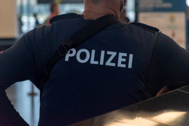 Polizei inscription on Austrian police officer (Polizei means Police in German language). clipart