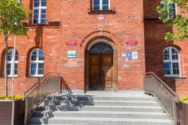 Szczecinek, Poland - May 31, 2021: Entrance to Town Hall at the marketplace.