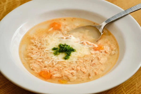 Tasty salmon fish soup with cheese and green parsley on plate with spoon — Stock Image Tasty Salmon Fish Soup Cheese Green Parsley Plate Spoon Stock Image