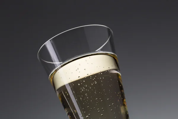 Glass champagne with dew — Stock Photo, Image