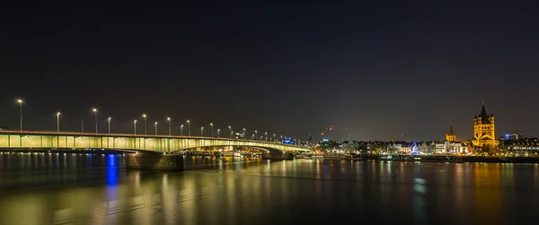 Deutzer bridge at night in cologne panorama — Stok fotoğraf