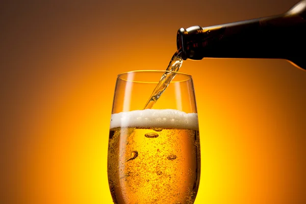 Pouring cold beer in a glass — Stock Photo, Image