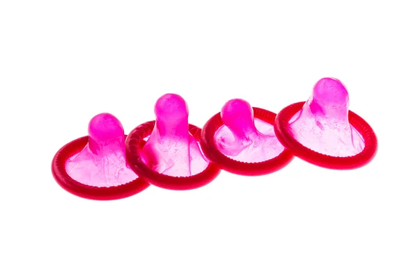 Four red condoms — Stock Photo, Image