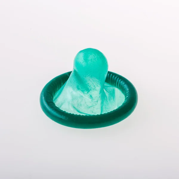 Condom in green — Stock Photo, Image