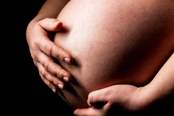 Pregnant woman caressing her belly baby — Stock Photo, Image