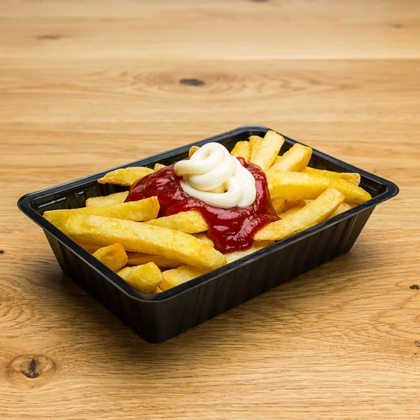 Fries with ketchup and mayonnaise — Stock Photo, Image