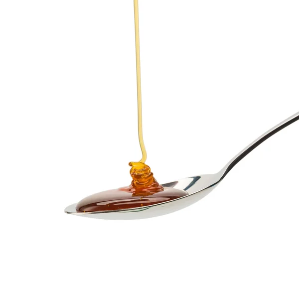 Miele d'oro su un cucchiaio — Foto Stock