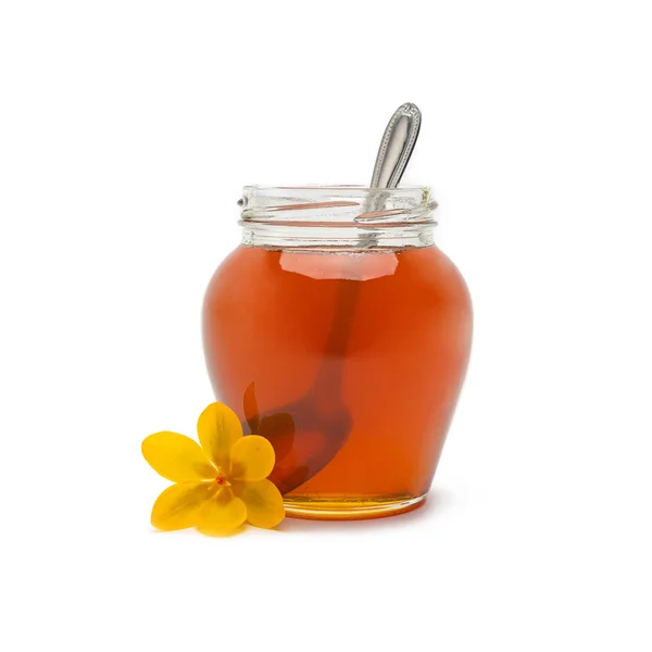 Pot of honey with spoon — Stock Photo, Image