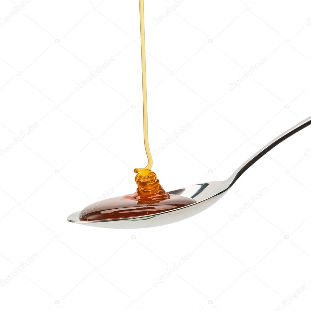 Golden honey on a spoon