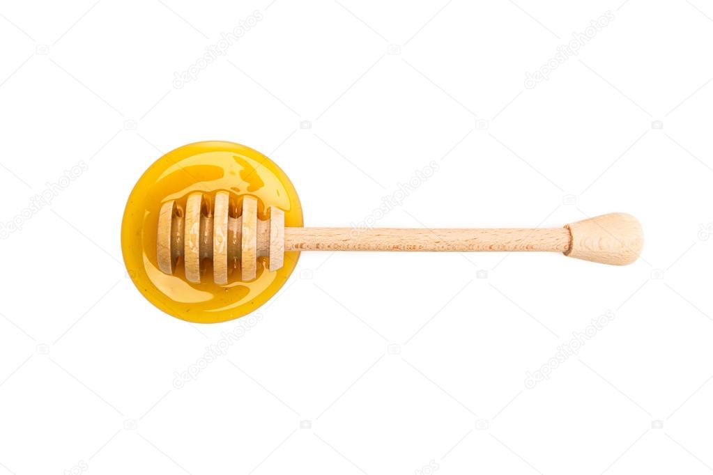 Honey dipper lies in honey
