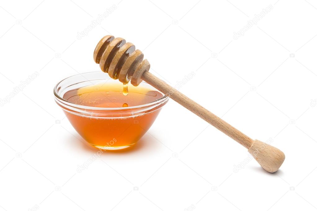 Honey dipper with honey in a shell