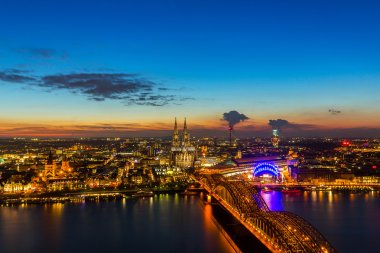 Cologne Cathedral and Hohenzollern at sunset clipart