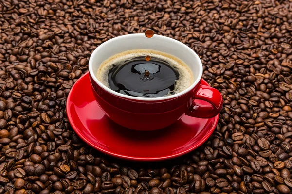 Cup of coffee with a row of drops — Stock Photo, Image