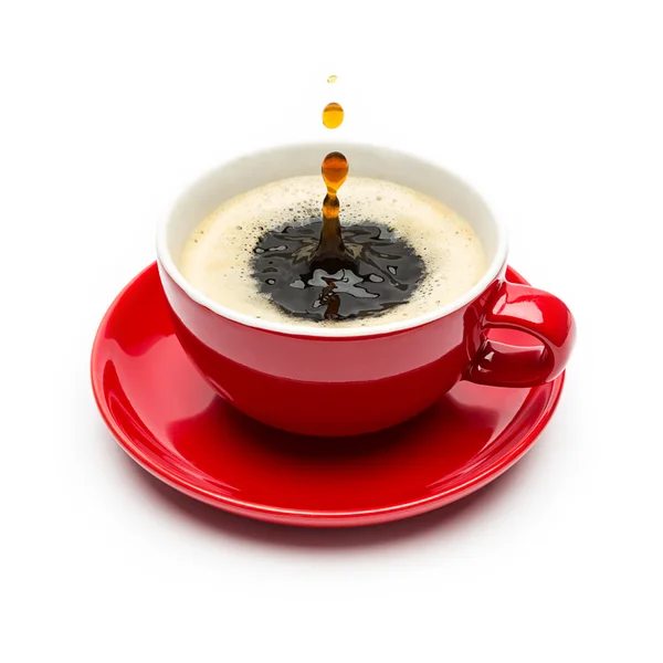 Drops falling into a cup of coffee — Stock Photo, Image