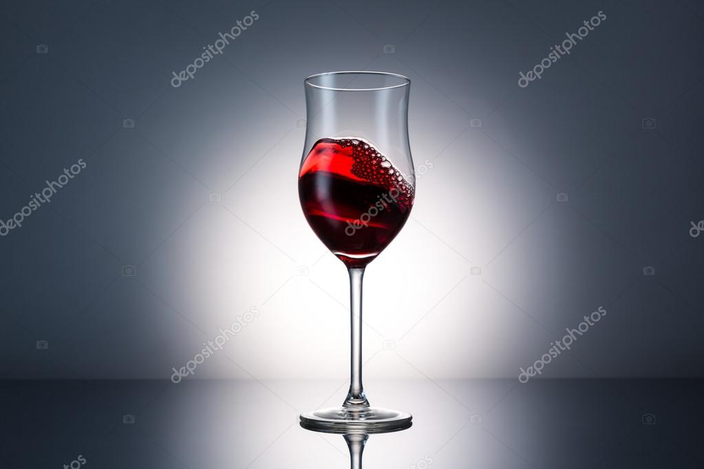 wave of red wine in a glass