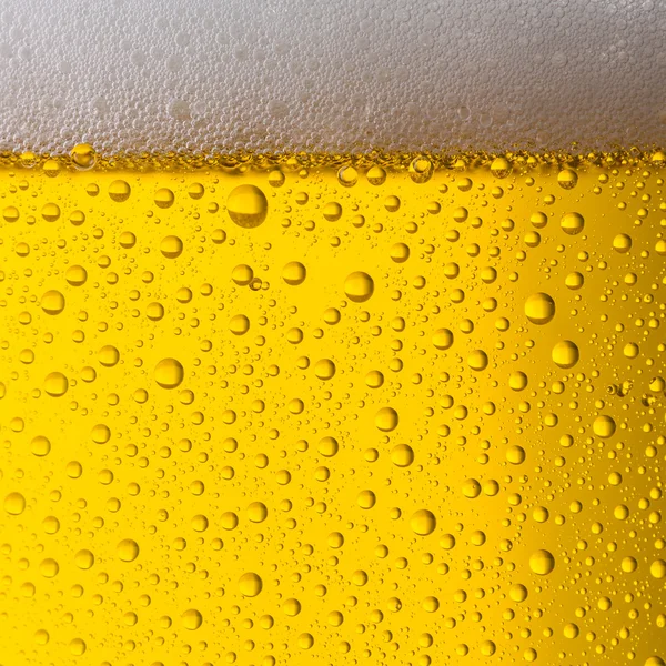 Fundo textura de cerveja dourada — Fotografia de Stock