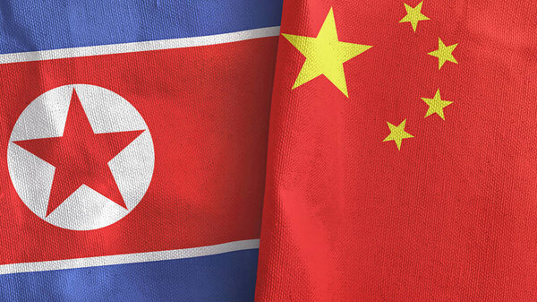 China and North Korea two flags textile cloth 3D rendering