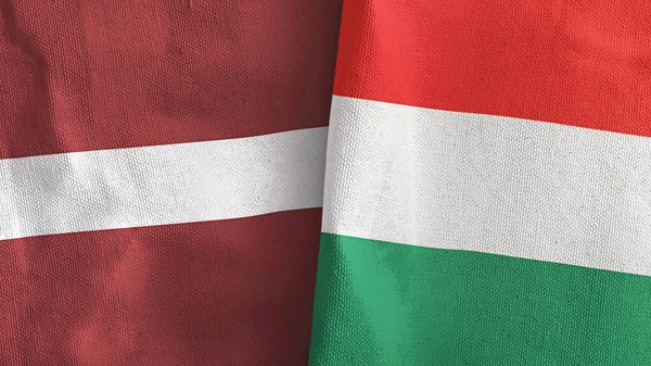 Hungary and Latvia two flags textile cloth 3D rendering — Stock fotografie