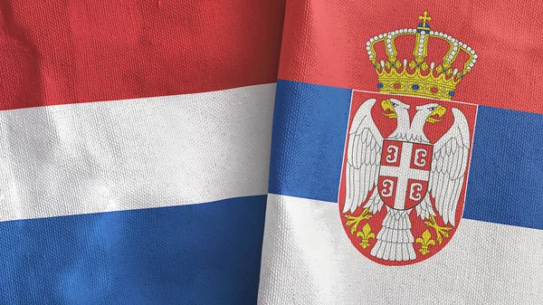 Serbien och Nederländerna två flaggor textilduk 3D-rendering — Stockfoto