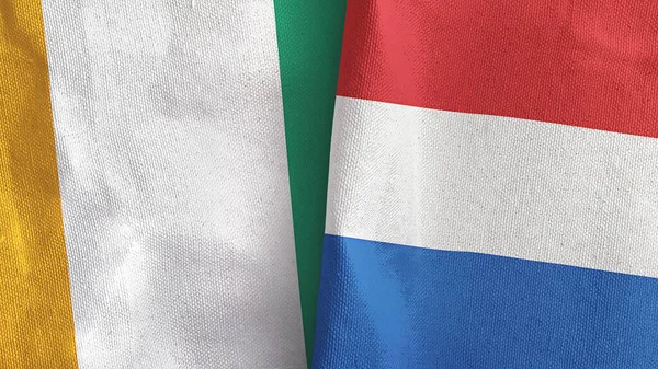 Netherlands and Cote dIvoire Ivory coast two flags textile cloth 3D rendering —  Fotos de Stock