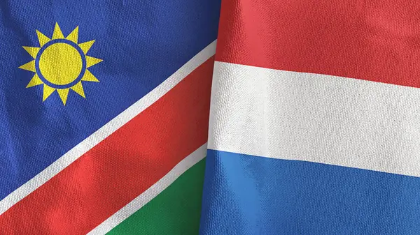 Nederland en Namibië twee vlaggen textiel doek 3D rendering — Stockfoto