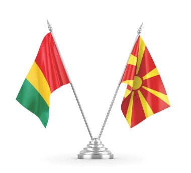 Kuzey Makedonya ve Gine masa bayrakları beyaz 3D görüntülere izole edildi