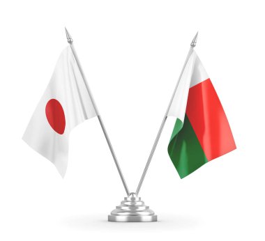 Madagaskar ve Japonya masa bayrakları beyaz 3D görüntüleme üzerinde izole edildi
