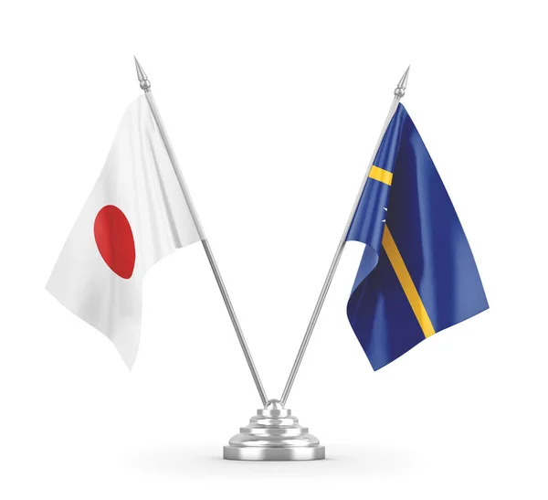 Bandiere da tavolo Nauru e Giappone isolate su rendering 3D bianco — Foto Stock