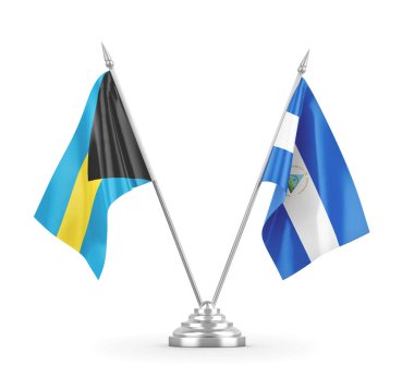 Nikaragua ve Bahamalar masa bayrakları beyaz 3D görüntüleme üzerinde izole edildi