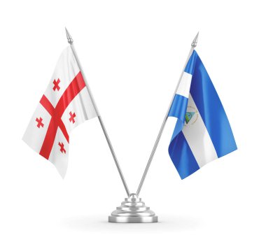 Nikaragua ve Gürcistan masa bayrakları beyaz 3D görüntüleme üzerinde izole edildi