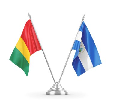 Nikaragua ve Gine masa bayrakları beyaz 3D görüntüleme üzerinde izole edildi