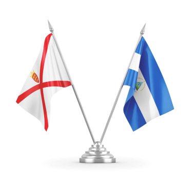 Nikaragua ve Jersey masa bayrakları beyaz 3D görüntüleme üzerinde izole edildi