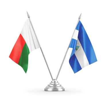 Nikaragua ve Madagaskar masa bayrakları beyaz 3D görüntüleme üzerinde izole edildi