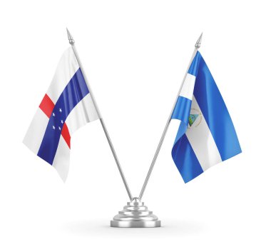 Nikaragua ve Hollanda Antilleri masa bayrakları beyaz 3D görüntüleme üzerinde izole edildi