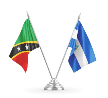 Nikaragua, Saint Kitts ve Nevis masa bayrakları beyaz 3D görüntülerde izole edilmiştir.