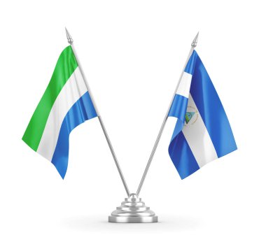 Nikaragua ve Sierra Leone masa bayrakları beyaz 3D görüntüleme üzerinde izole edildi