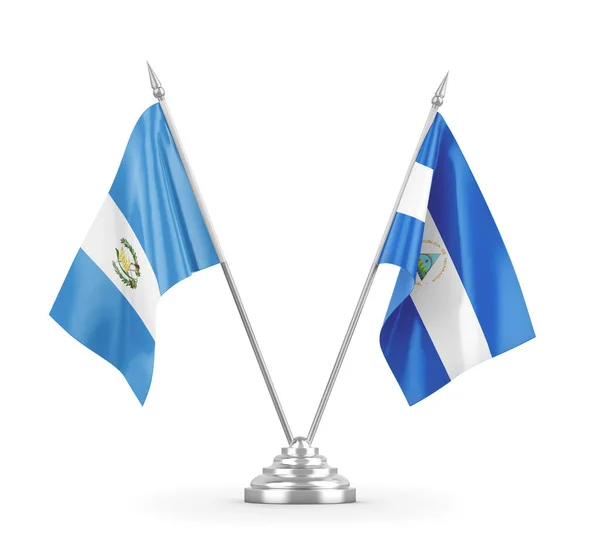 Bandiere da tavolo Nicaragua e Guatemala isolate su rendering 3D bianco — Foto Stock